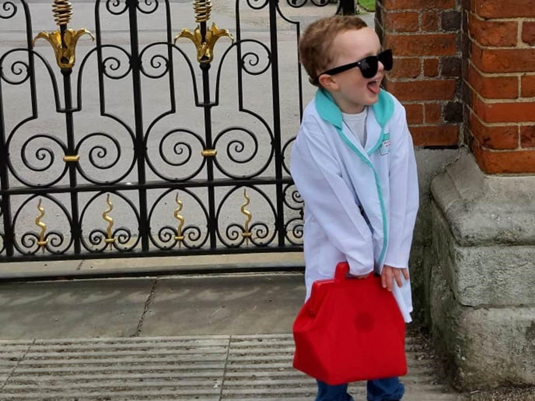 Hugo finishes his fundraising walk dressed as a doctor