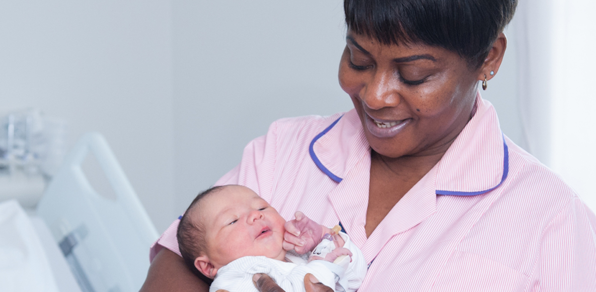 Nurse holding baby