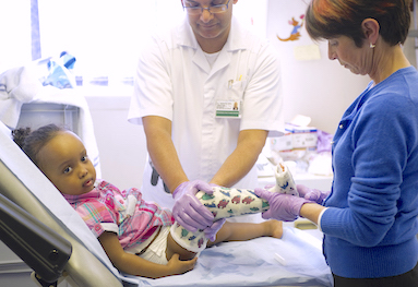 Young child having a leg cast fitted in hospital