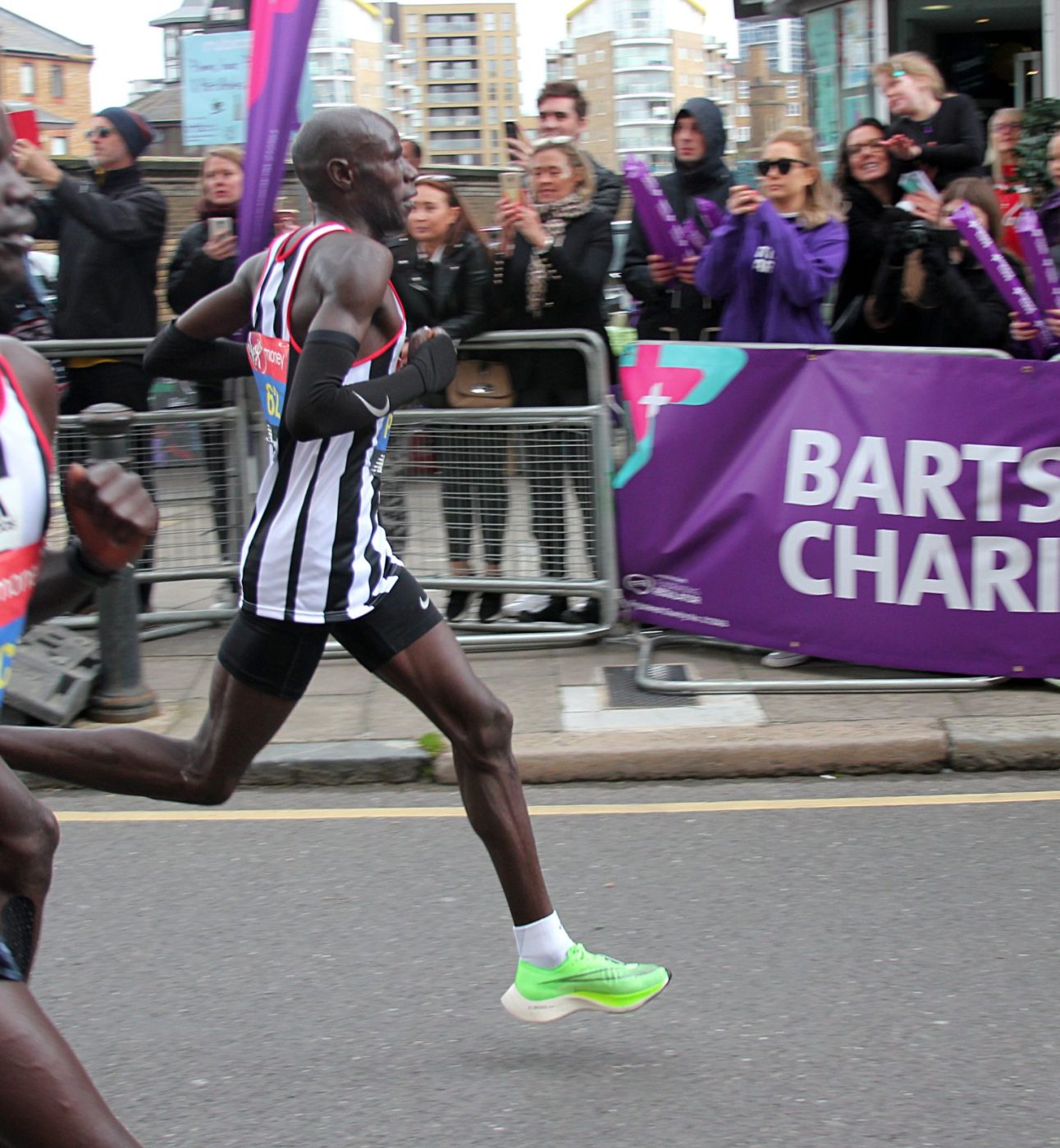 Runners for the London Marathon passing the Barts Charity cheer point