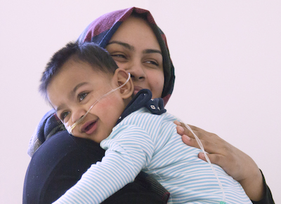 Woman holding her child