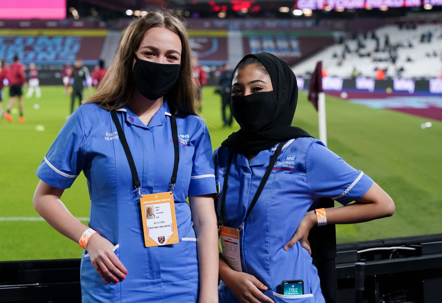 Flagbearers Bianca and Nasiha from Newham Hospital 1