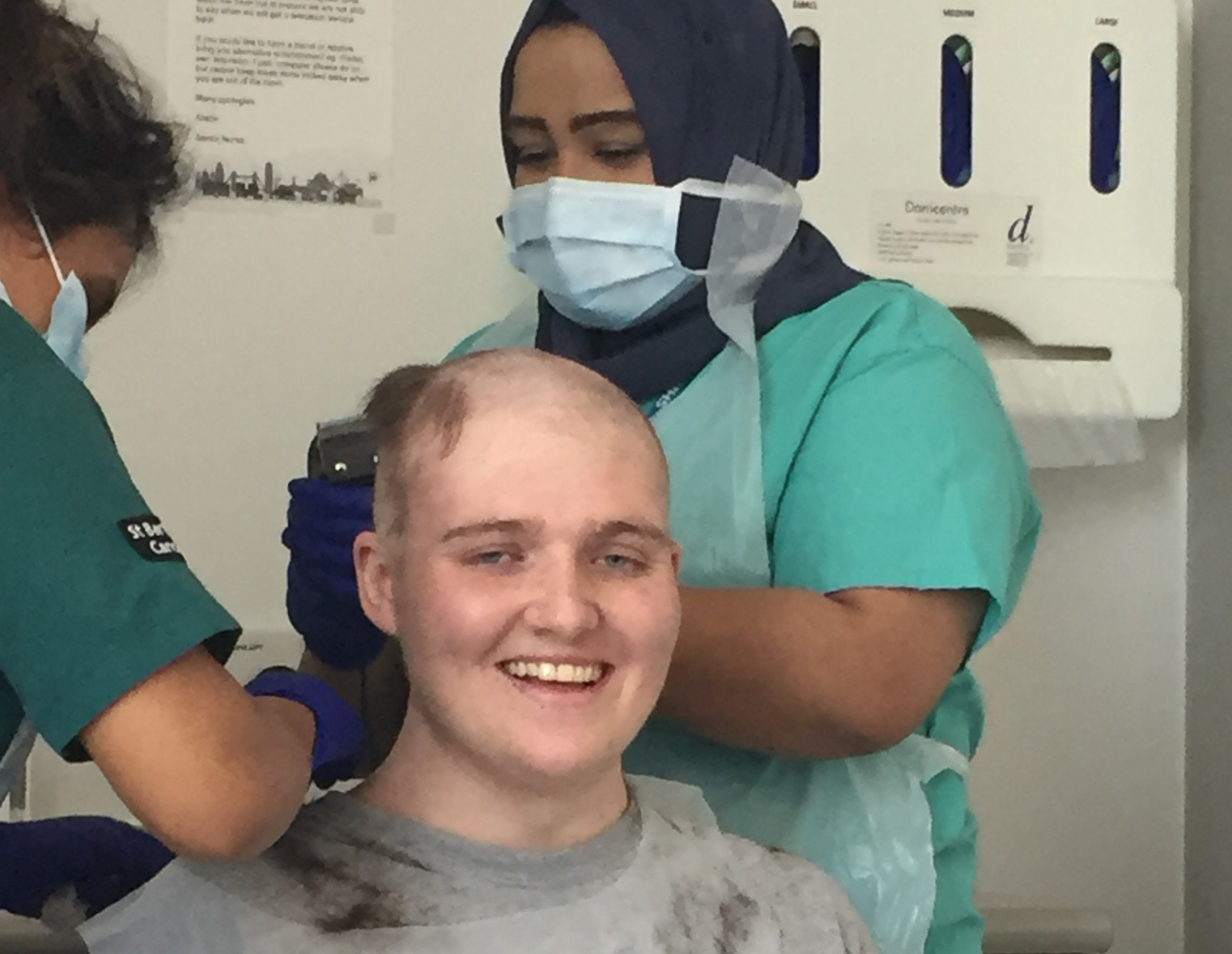 Callum having his head shaved in hospital