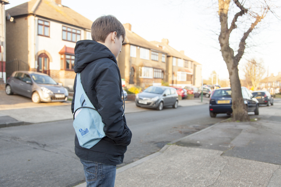 boy walking on the street