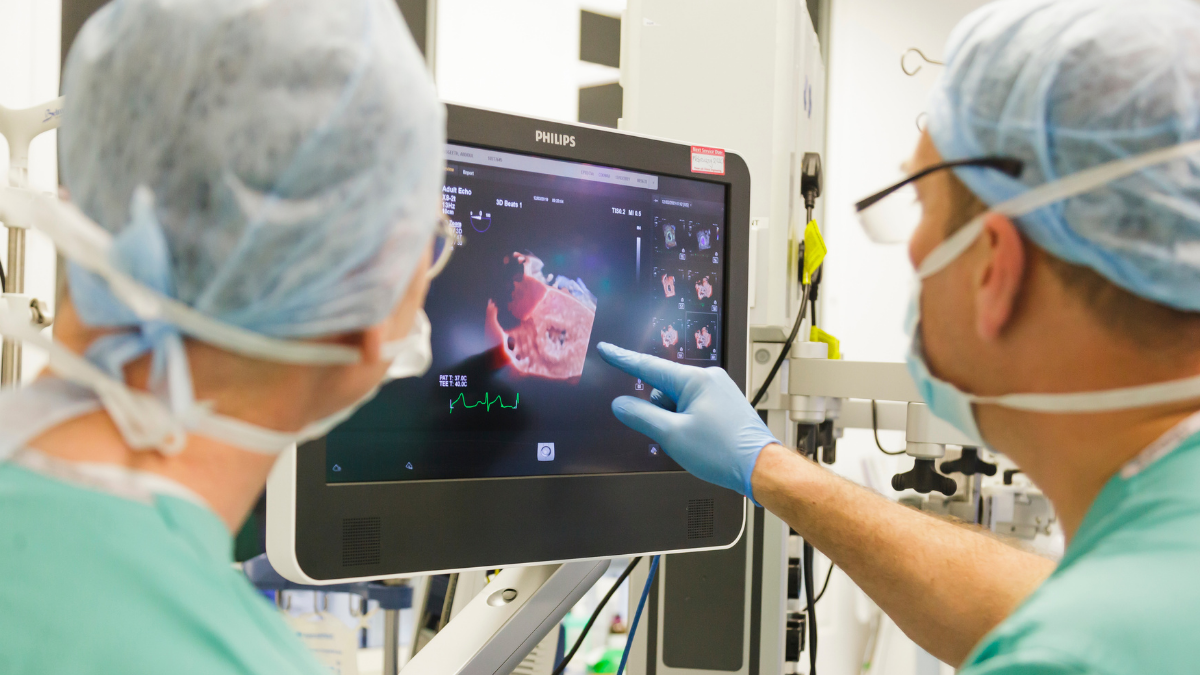 Doctors looking at a screen