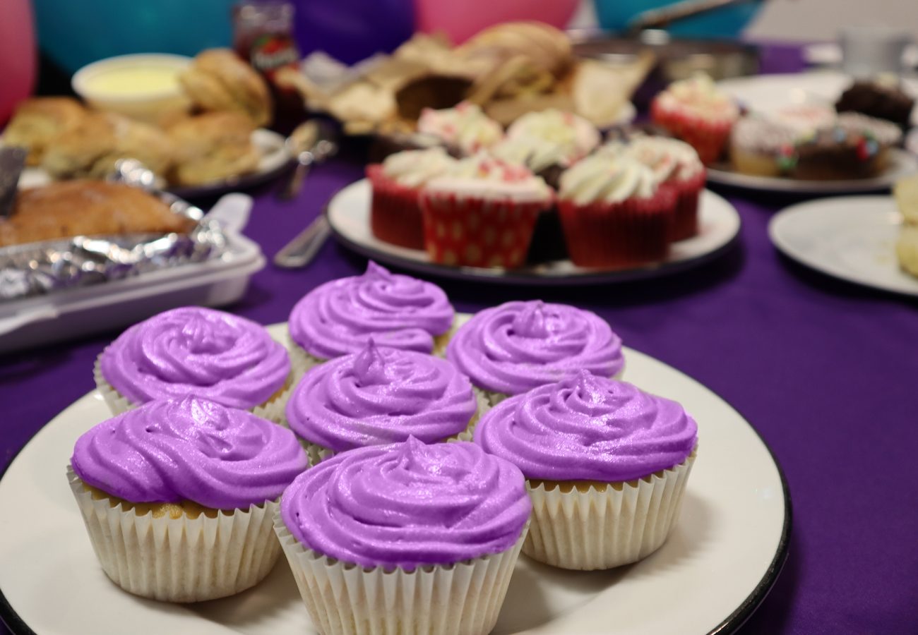 purple cupcakes at a Barts Charity bake sale