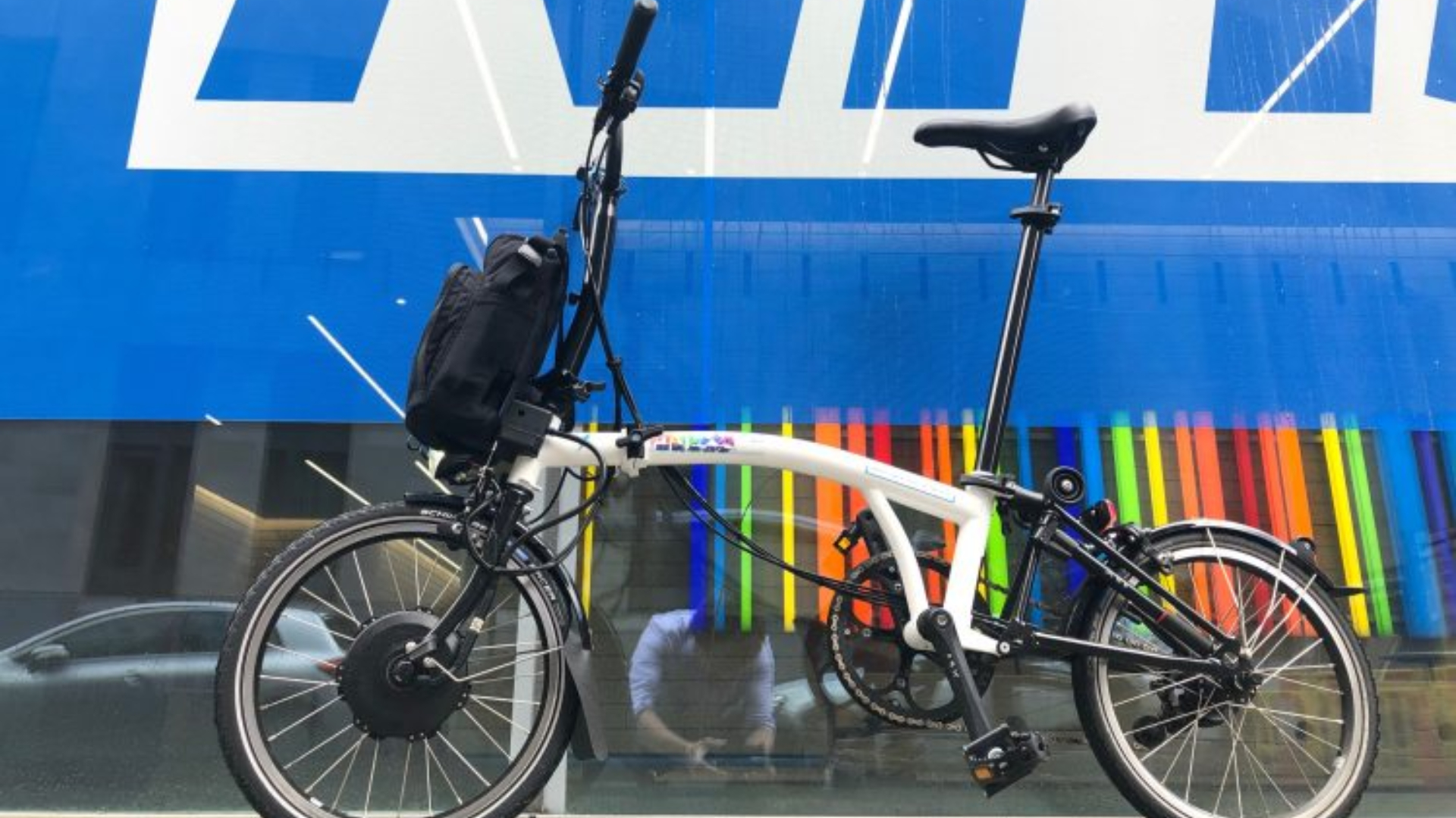 Brompton e-bike, unfolded and outside a hospital for NHS staff use