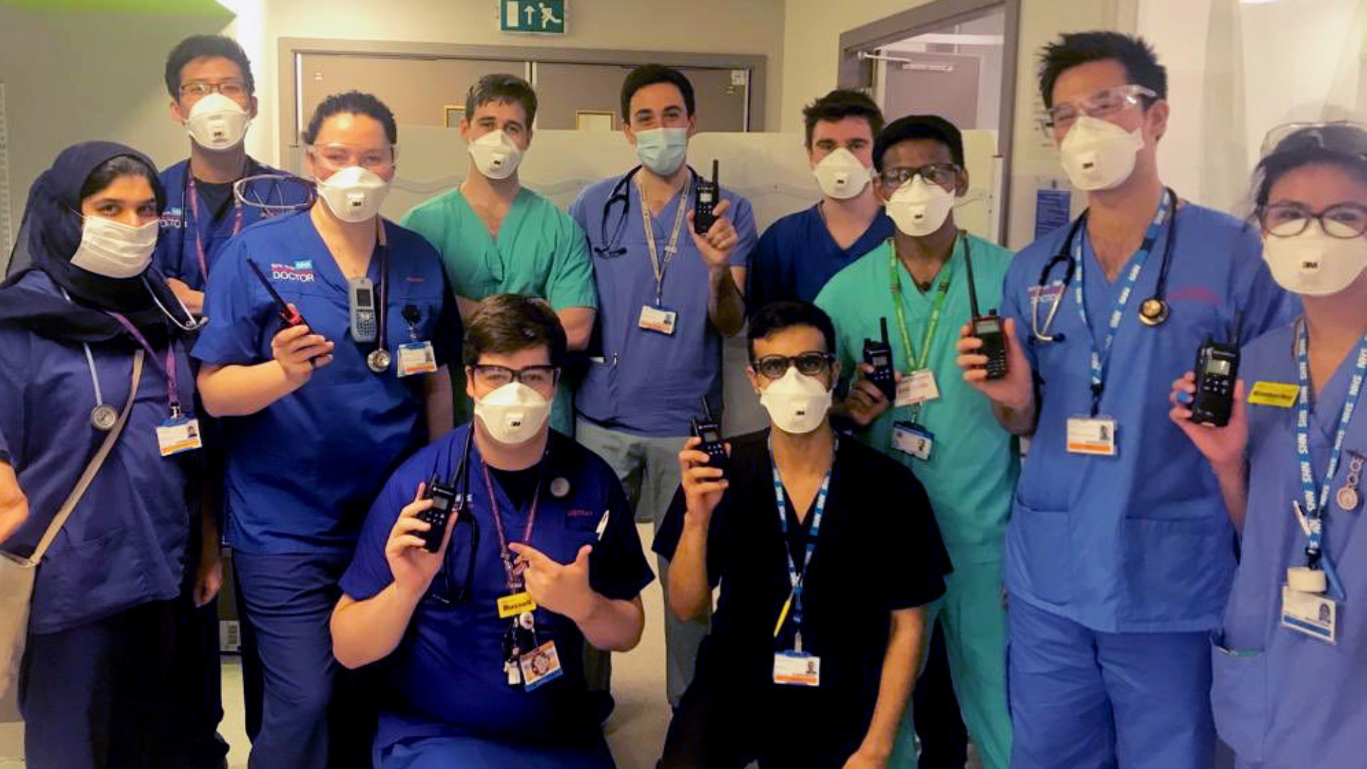NHS staff with walkie-talkies