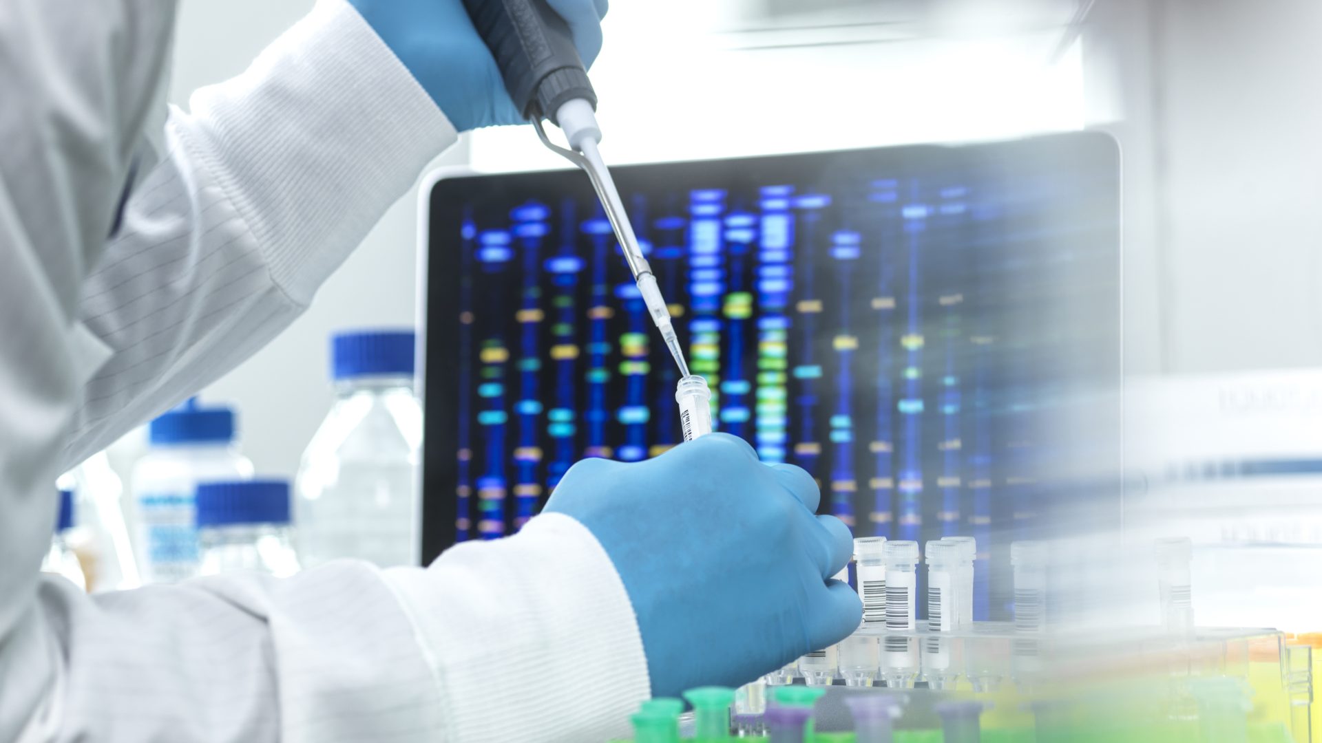 Scientist pipetting sample into a vial for DNA testing