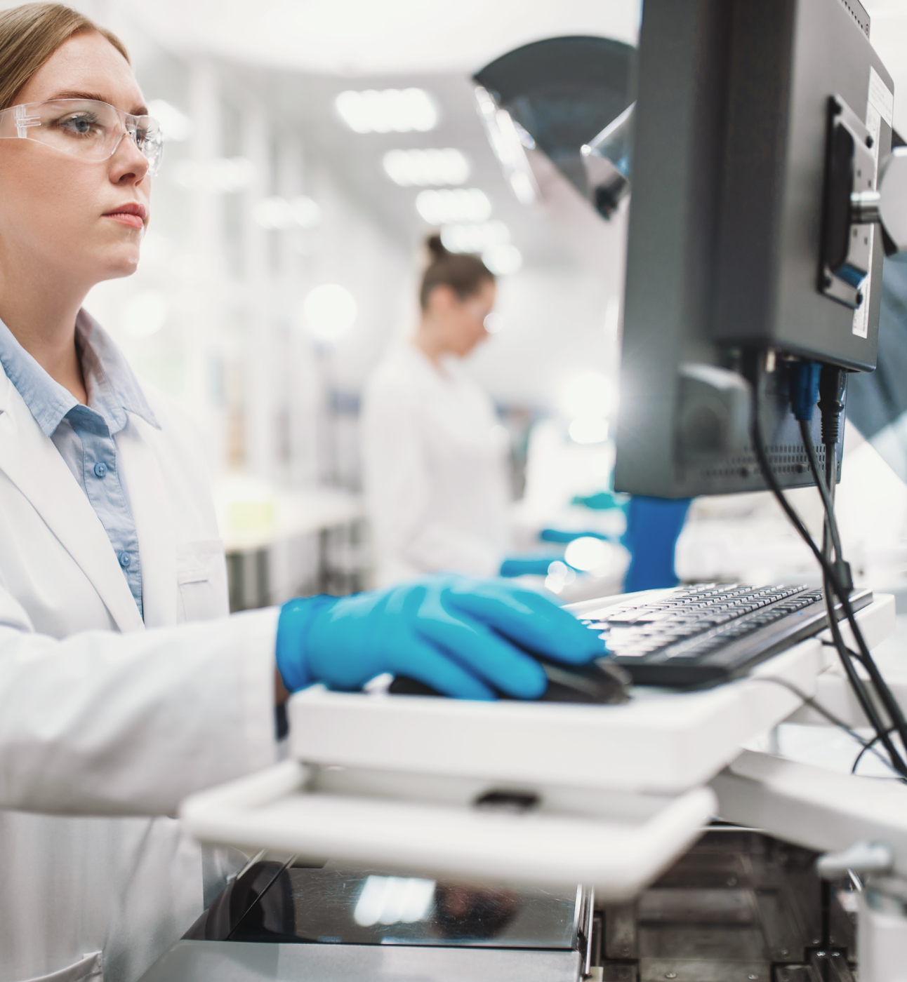 Female researcher in lab using a computer