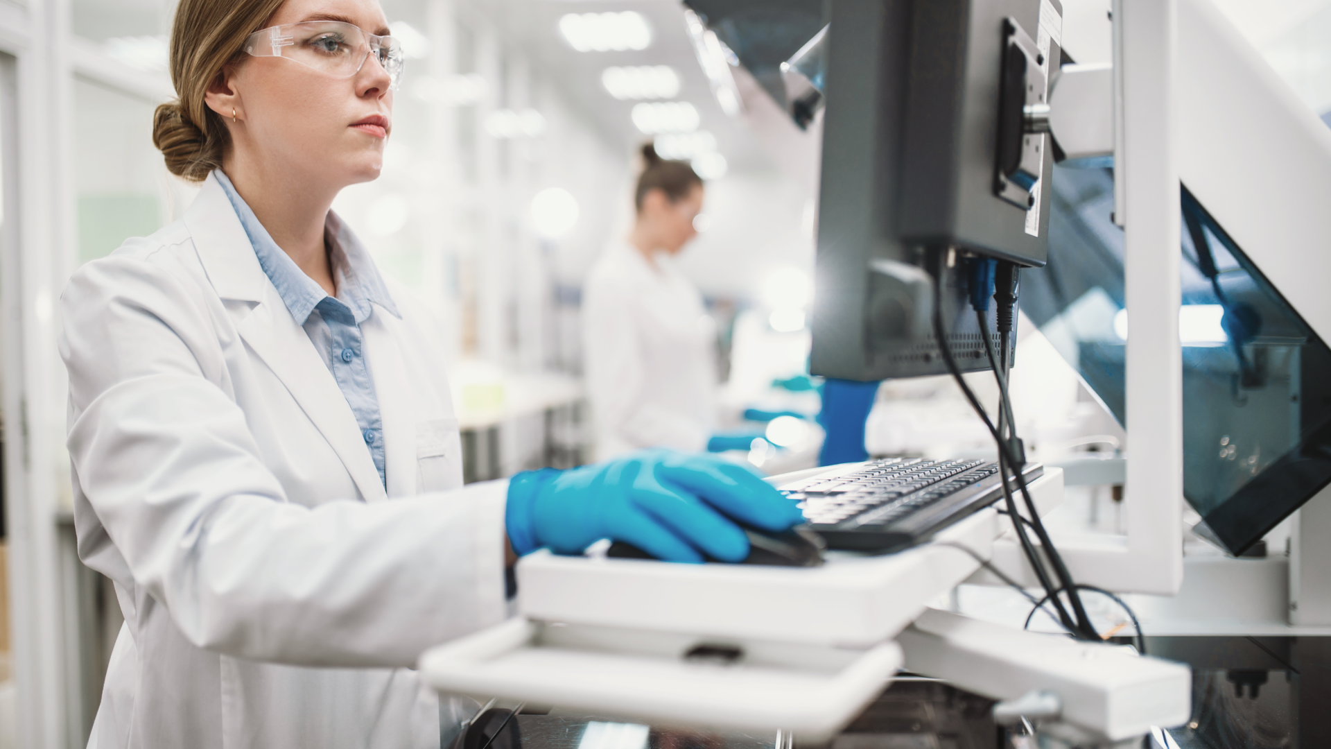 Female researcher in lab using a computer