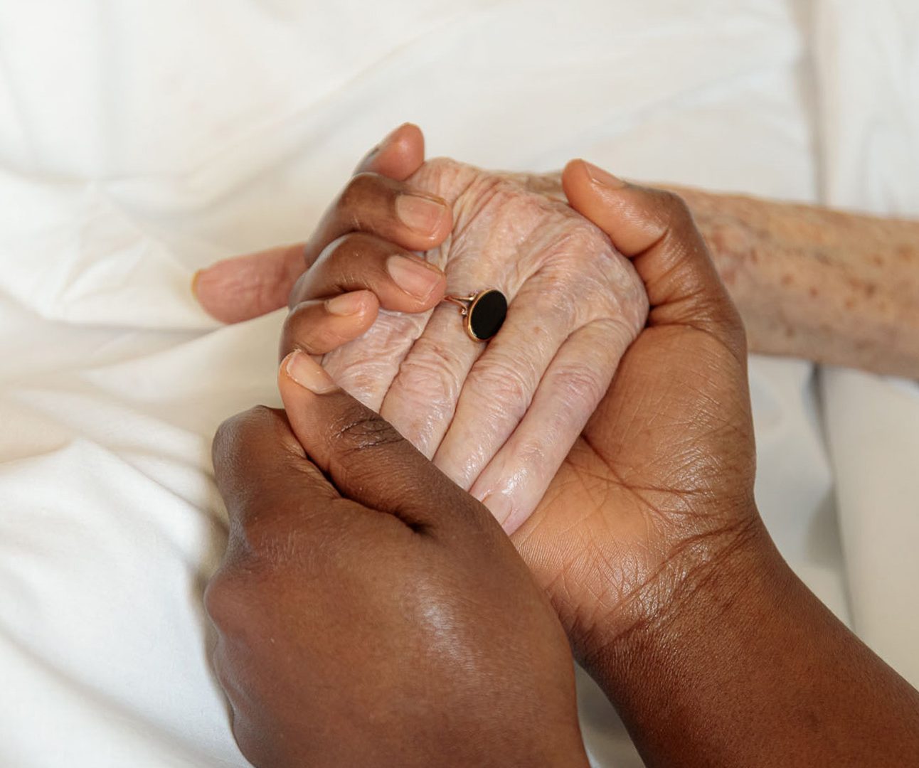 Holding hands with a patient