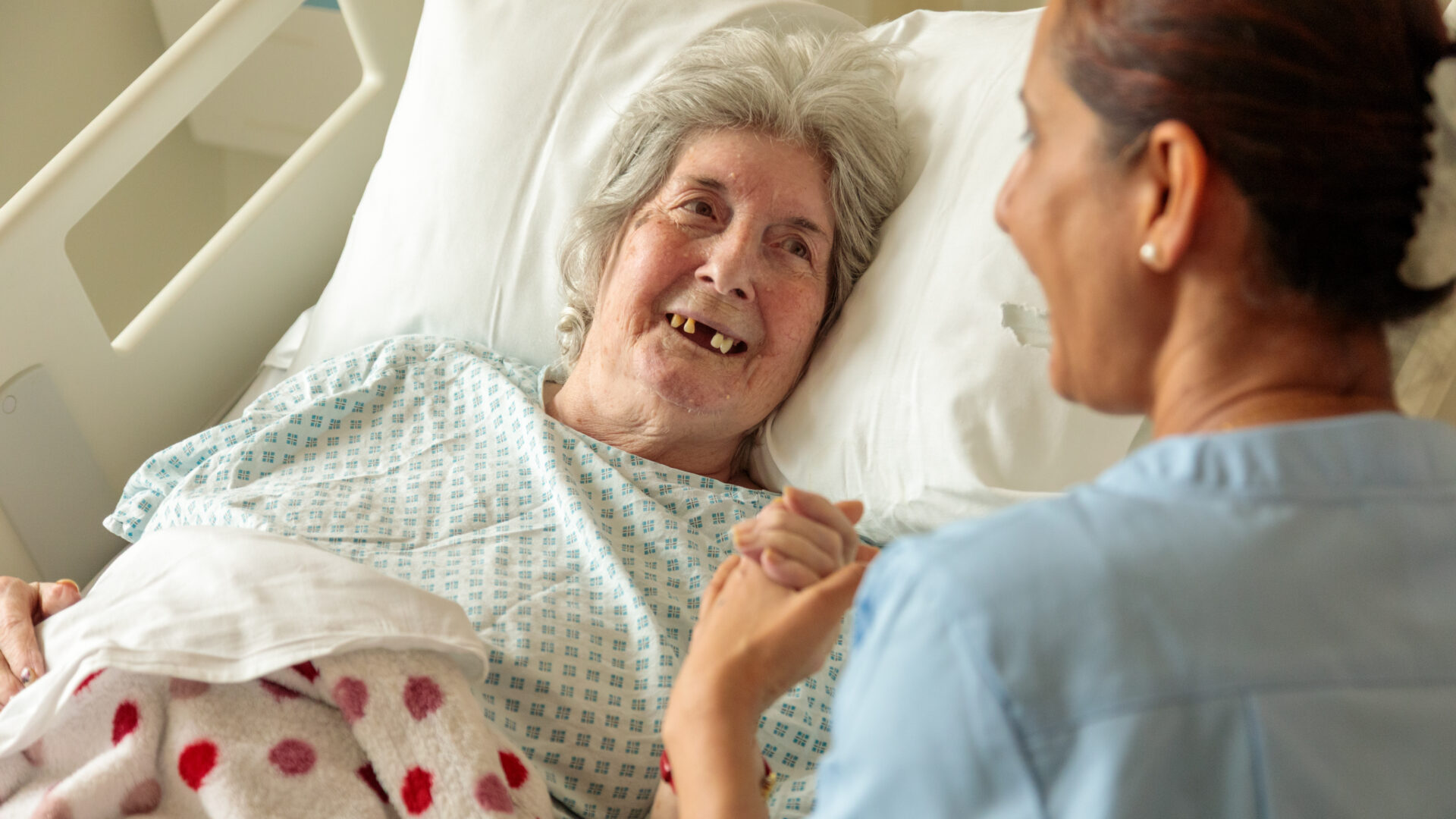 Patient Irene and Barts Health staff member Sirjana on the older people's ward.