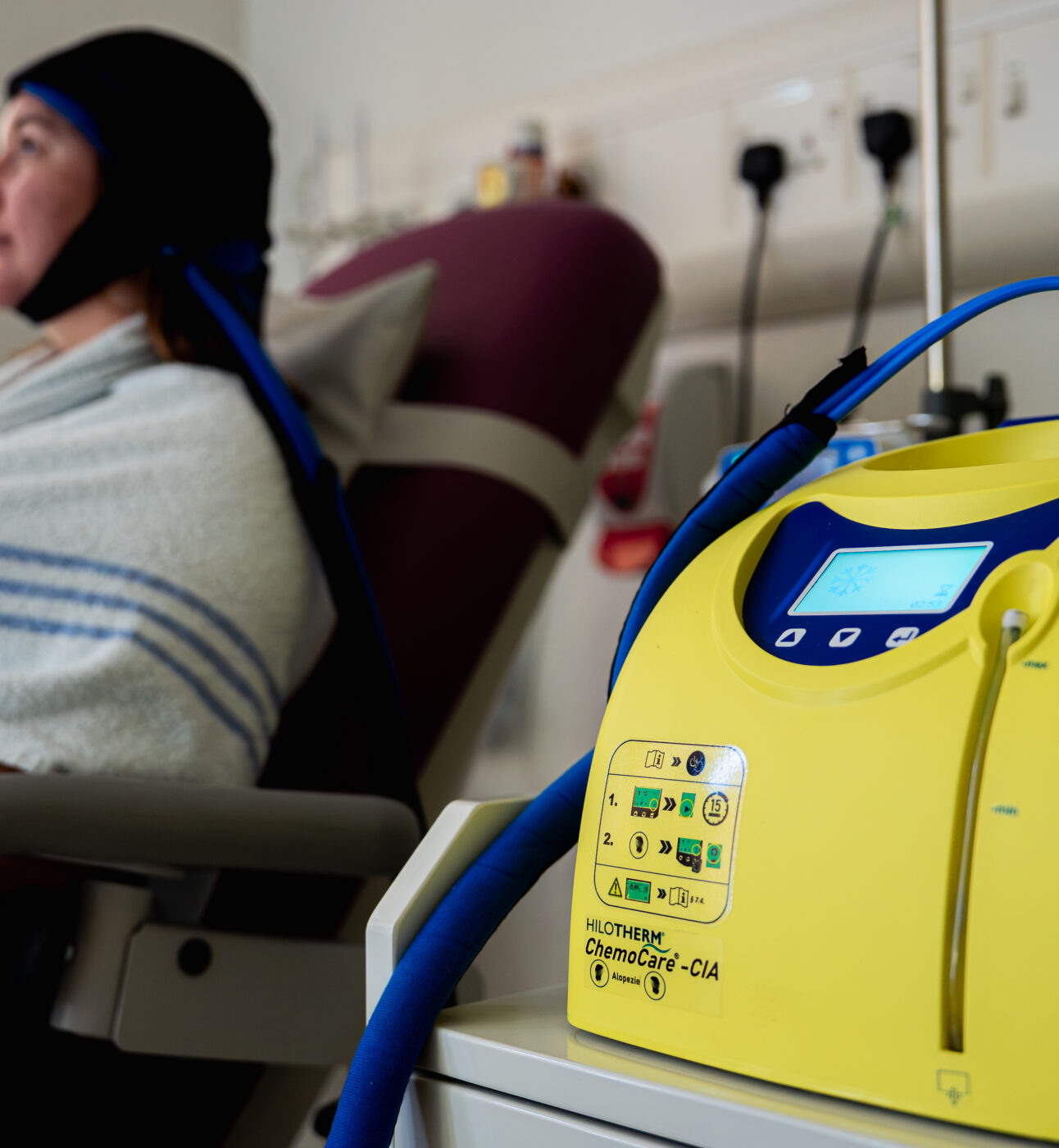 A woman getting cold cap treatment at St Bartholomew's Hospital