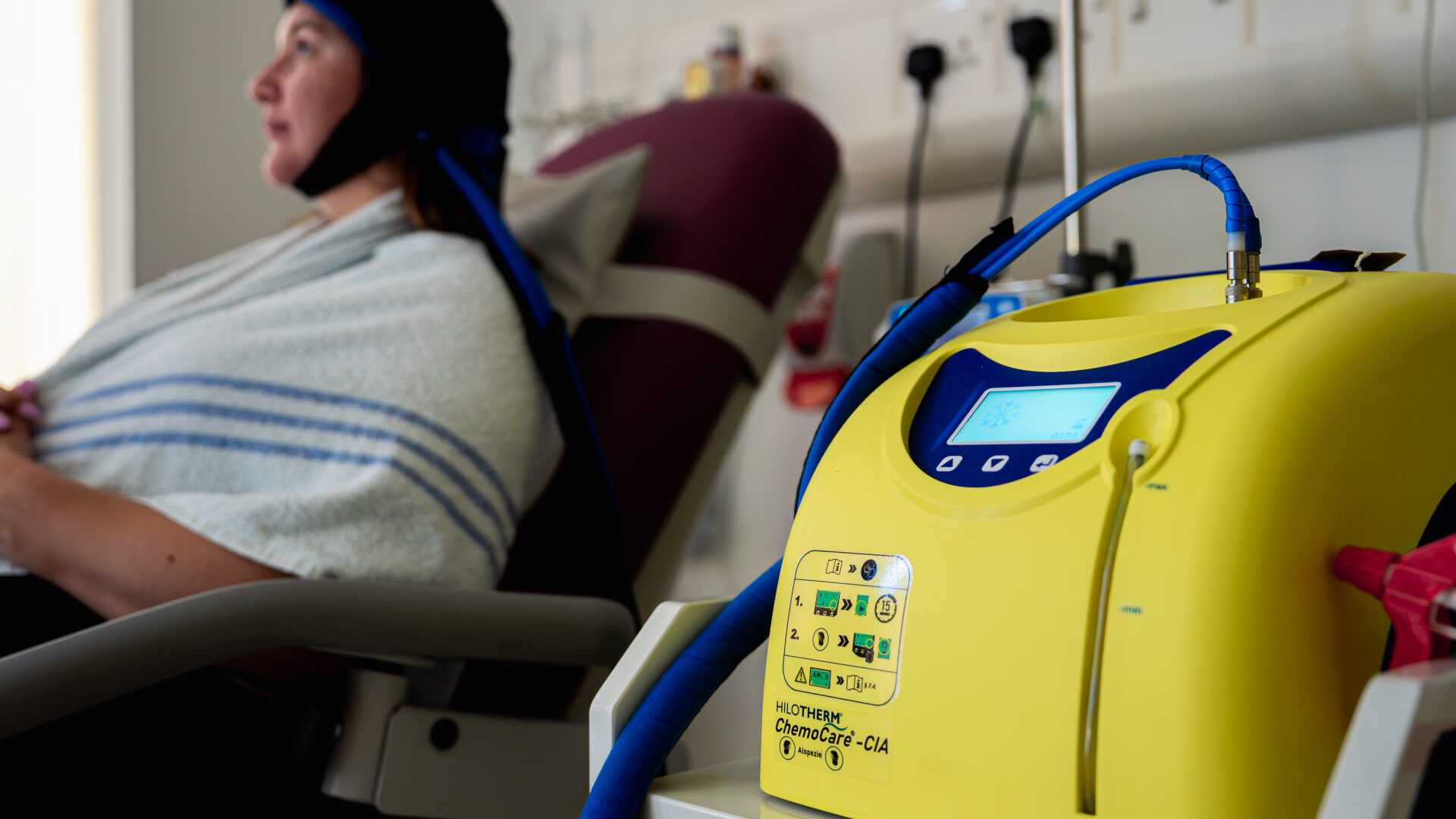 A woman getting cold cap treatment at St Bartholomew's Hospital