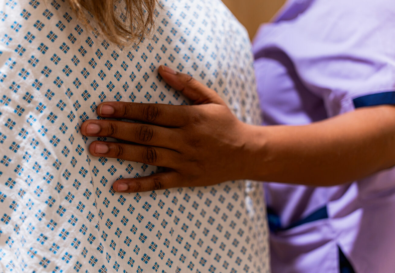 A staff supporting a patient who is getting a mammogram at St Bartholomew's Hospital